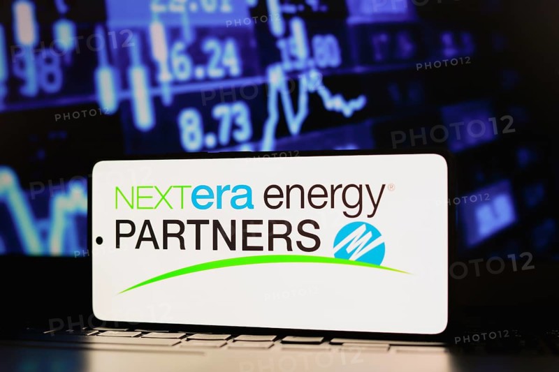 In this photo illustration, the NextEra Energy Partners LP logo is displayed on a smartphone screen