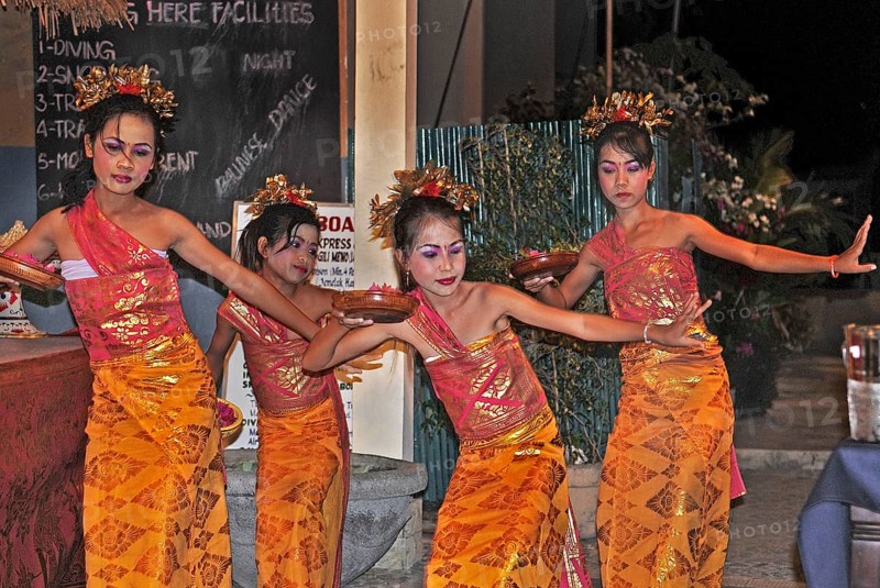 Balinese girls dancing for dinner, Amed, Bali, Indonesia, Asia