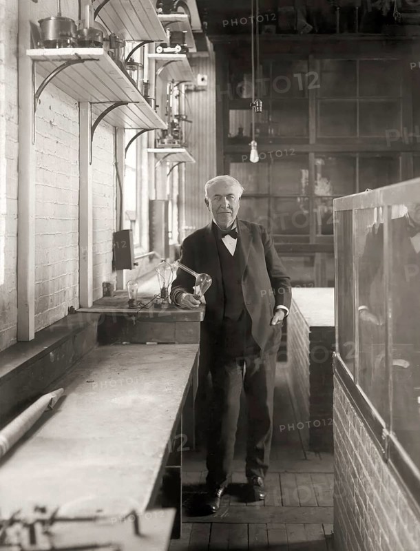 Thomas Alva Edison with his lightbulb, digitally edited