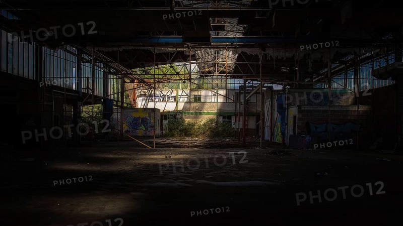 Dark abandoned factory building with light beam and graffiti, Gerresheimer Germany, Lost Place, Glashütte Gerresheim, Düsseldorf Gerresheim, North Rhine-Westphalia, Germany, Europe