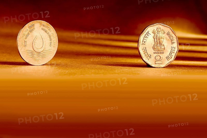 Double pair Indian currency two rupees coin front side and backside manner embossed water for life world food day 1994 on orange background