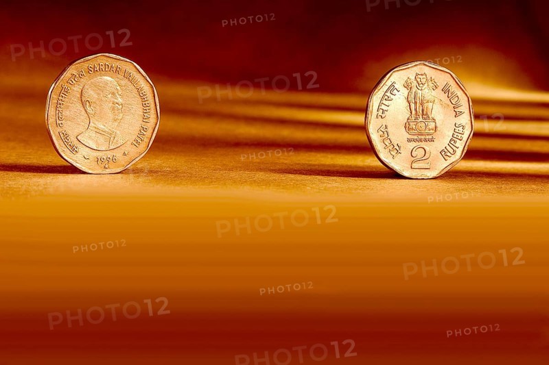 Double pair Indian currency two rupees coin front side and backside manner embossed Sardar Vallabhbhai Patel 1996 on orange background