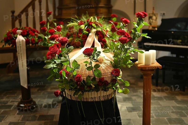 Red rose at the coffin, farewell to a dear deceased in the church in the Dutch province of Drenthe, Netherlands