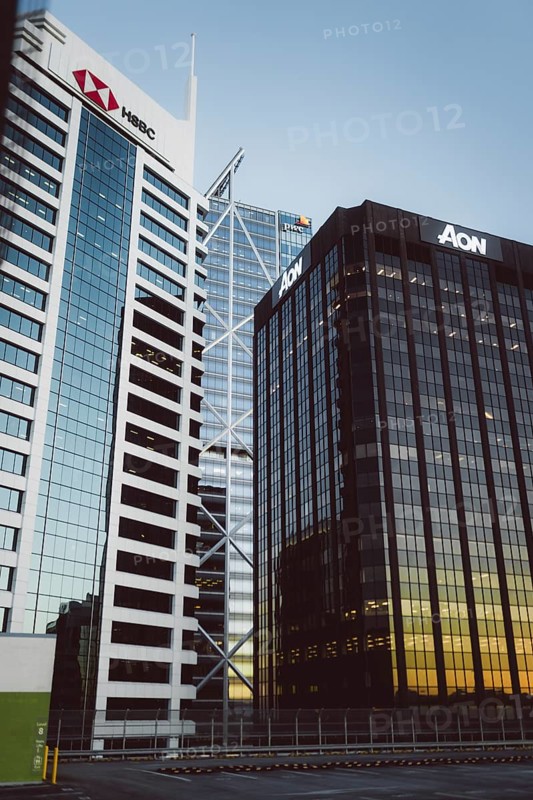 Two modern buildings with the focus on their glass facades at sunset, Auckland, New Zealand, Oceania