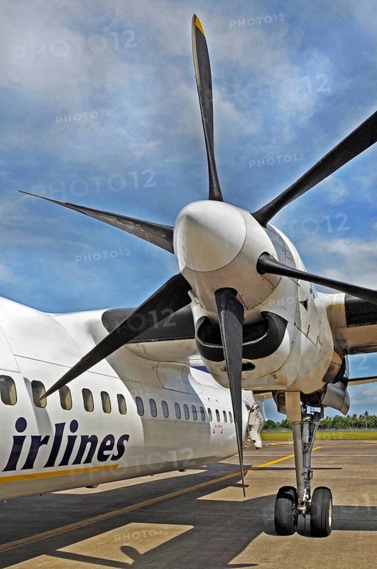 Propeller aircraft, prop jet Fokker 50, former Riau Airlines, at the airport in Labuan Bajo, Flores Island Indonesia