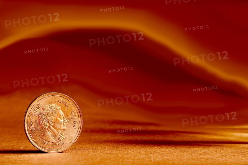 One single Indian currency five rupees coin and artistic background backside embossed Indira Gandhi 1917-1984