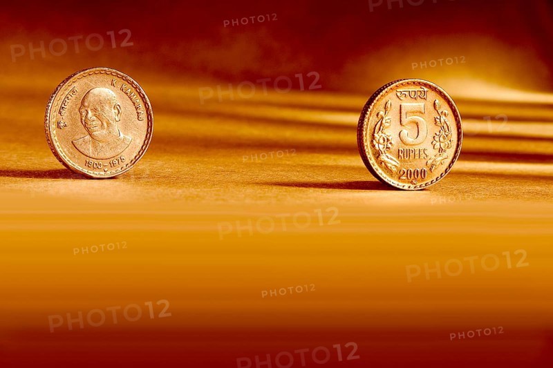 Double pair Indian currency five rupees coin front side and backside manner embossed K. Kamaraj 1903-1975 on orange background