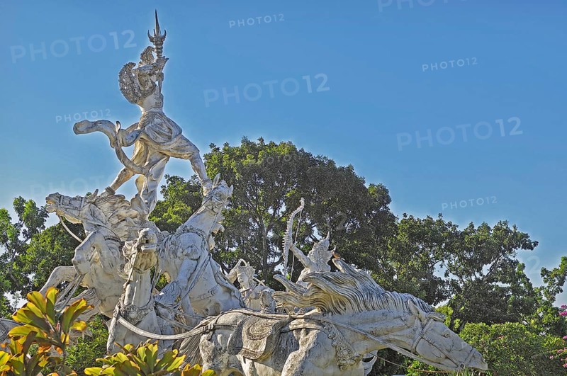 Balinese stone mythology figures on horse statues, Denpasar, Bali, Indonesia, Asia