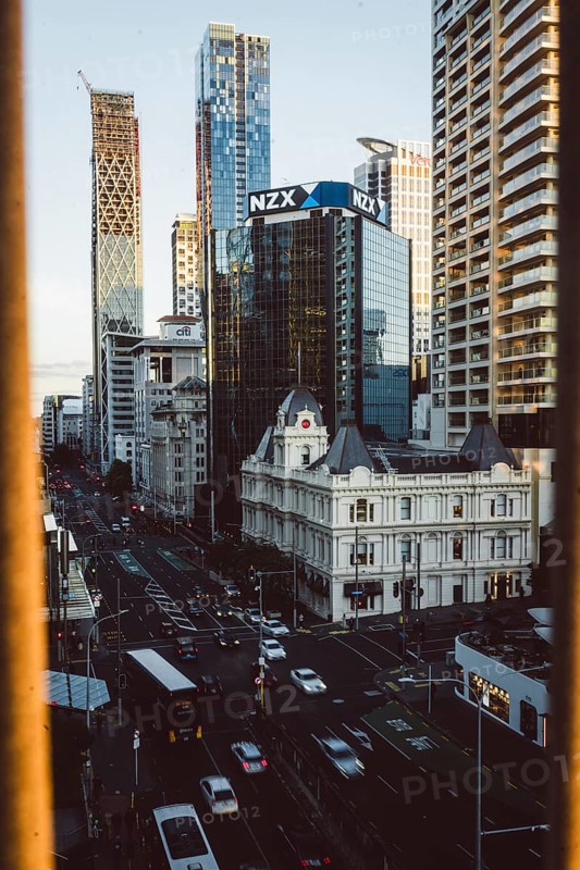 Urban scene with the NZX building and busy streets in the foreground, new zealand stock exchange, Auckland, New Zealand, Oceania