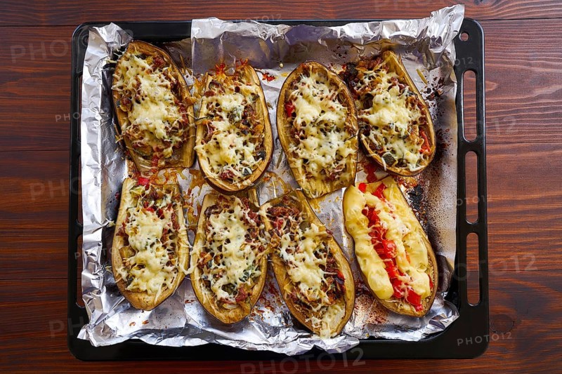 Meat stuffed eggplants recipe on brown wood table