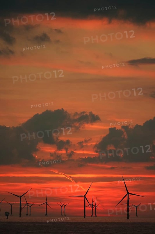 Sky over Baltic Sea wind farm at sunset