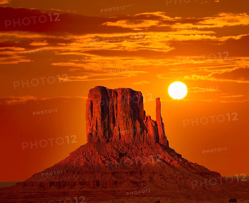 Monument Valley West Mitten at sunrise sun orange sky Utah photo mount