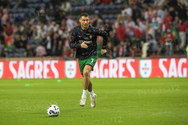 Football match, Cristiano RONALDO CR7 Portugal warming up in front of the match jumping slightly high in front of shooting left on goal with ball, Estadio do Dragao, Porto, Portugal, Europe