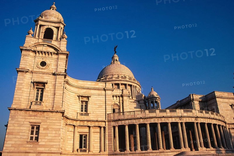 Side view of Victoria Memorial, Built between 1906 and 1921 in memory of Queen Victoria Topped with moving angel Statue, Kolkata, West Bengal, India, Asia