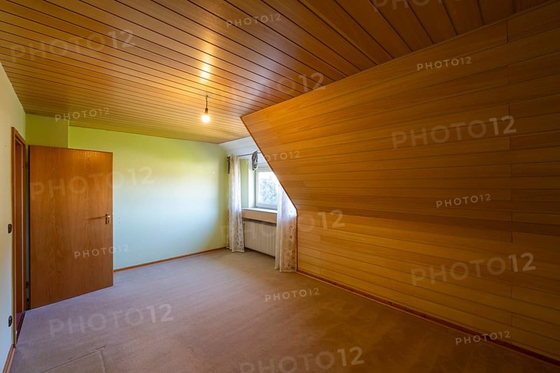 Renovated room in an old building without furniture, brown ceiling panels and wall panels, carpeted floor, North Rhine-Westphalia, Germany, Europe