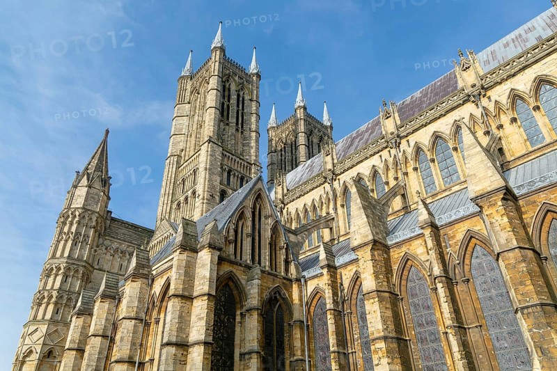 Looking up at west towers of Lincoln cathedral church, city of Lincoln, Lincolnshire, England, UK