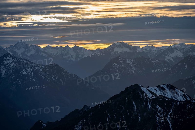 Mountain panorama with snow at sunset, in autumn, view from Kramerspitz, Bavarian Prealps, Bavaria, Germany, Europe