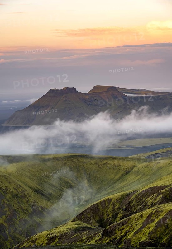 Fog between mountains, moss-covered volcanic mountain landscape, at sunset, Pakgil, Iceland, Europe