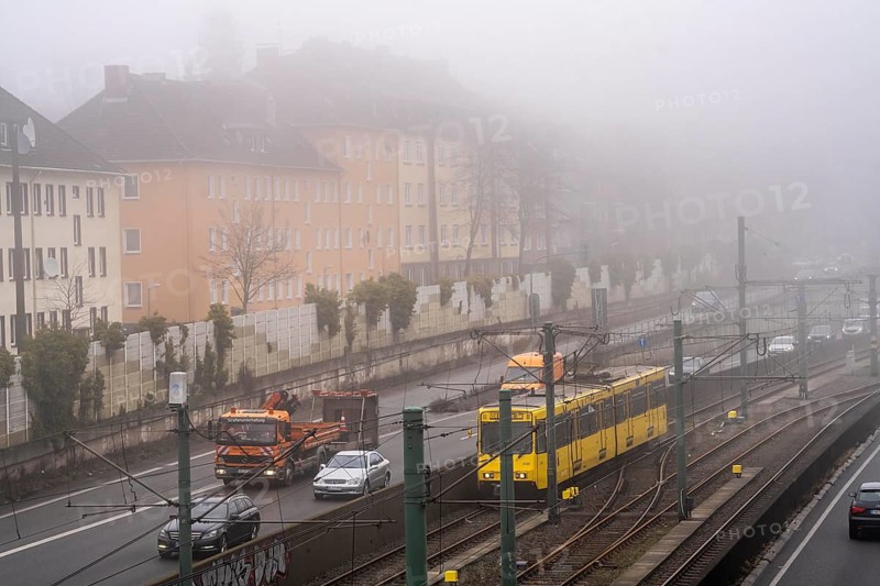 Dense fog, with visibility sometimes less than 100 metres, A40 motorway, city passage in Essen, underground line U18 in the middle lane, North Rhine-Westphalia, Germany, Europe