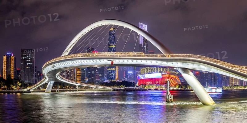 Guangzhou skyline with Haixin Bridge across the Pearl River skyscrapers panorama at night in Guangzhou, China, Asia