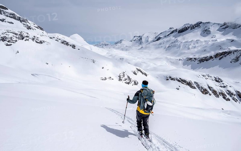 Ski tourer, winter in the Bernese Alps, ascent to the Wildstrubelhütte, Bernese Oberland, Switzerland, Europe