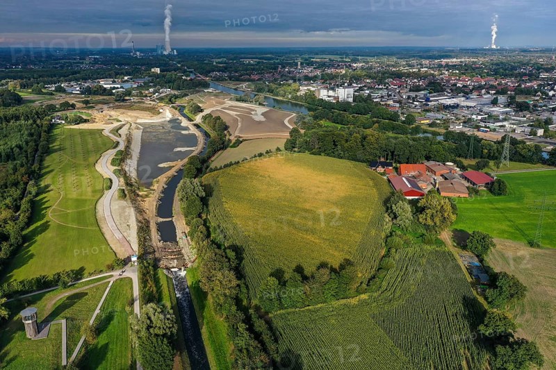 Recklinghausen, Castrop-Rauxel, North Rhine-Westphalia, Germany - EMSCHERLAND construction project, a 37-hectare water and nature discovery park at the water crossroads of the Rhine-Herne Canal and the renaturalised Emscher on the city boundary of Recklinghausen and Castrop-Rauxel. The ecological focal point at the confluence of Suderwicher Bach and Emscher will also be a future garden for the International Garden Exhibition 2027. Before the renaturalisation, the Emscher river system was an open, above-ground wastewater canal, combined sewer with surface water and wastewater. The Uniper power plant Datteln 4 in the background
