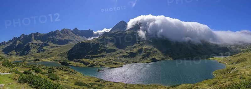 Lower Giglachsee with fog over the mountain ridge, Schladming, Styria, Austria, Europe