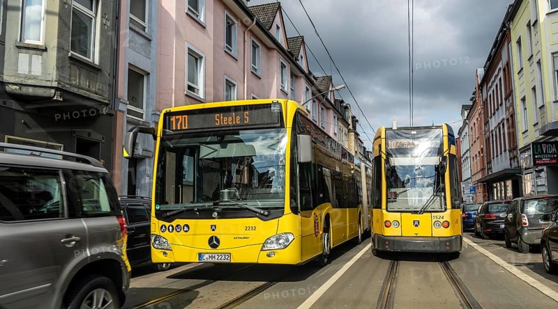 Tram and bus in traffic, on the street Schonnebeckhöfe in Essen-Katernberg, North Rhine-Westphalia, Germany, Europe