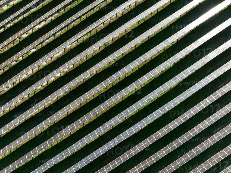 Rows of solar panels at a photovoltaic plant near the town of Espejo. Aerial view. Drone shot. Córdoba province, Andalucía, Spain, Europe