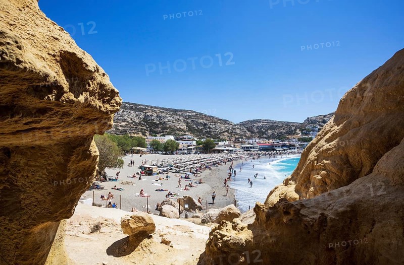 View from the rock caves to the beach of Matala, south coast, Crete, Greece, Europe