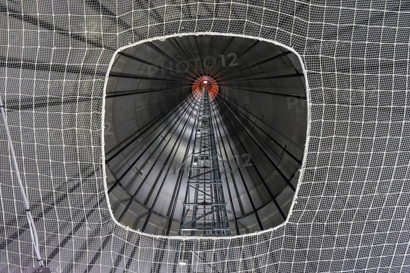 Dorsten, North Rhine-Westphalia, Germany, construction of a wind turbine, the first wind turbine of the Grosse Heide wind farm. View upwards through a safety net into the interior of the tower, Europe