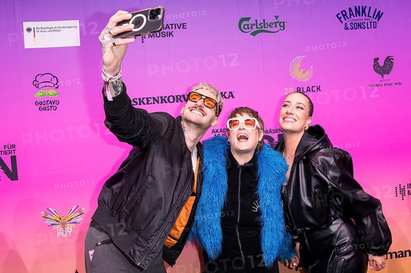 Guests take selfies on the red carpet in front of the Polyton 2024 award ceremony in Berlin's Atelier Gardens on 23 October 2024. The award has been held since 2023 and is a successor to the Echo music award