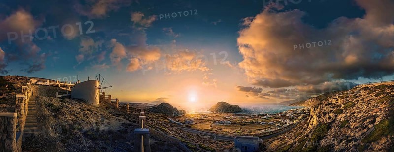 Picturesque sunset over a Mediterranean coastal landscape of Arkasa with windmill and sea view, Arkasa, Karpathos, Greece, Europe