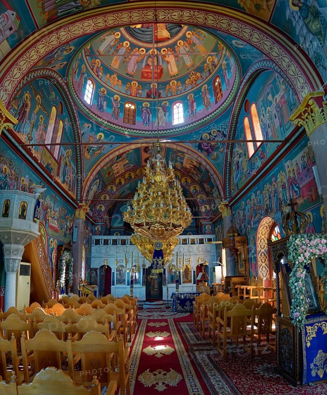 Interior of the church of Panagia Vrisiani with church dome, frescoes and magnificent chandelier in colourful surroundings, Mesochori, Karpathos, South Aegean, Greece, Europe