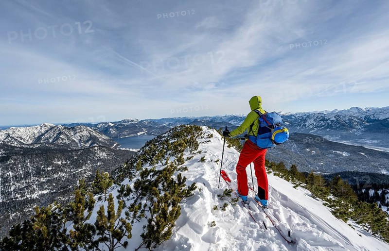 Ski tourer at the summit of Simetsberg, mountain panorama, Estergebirge, Bavarian Prealps, Bavaria Germany