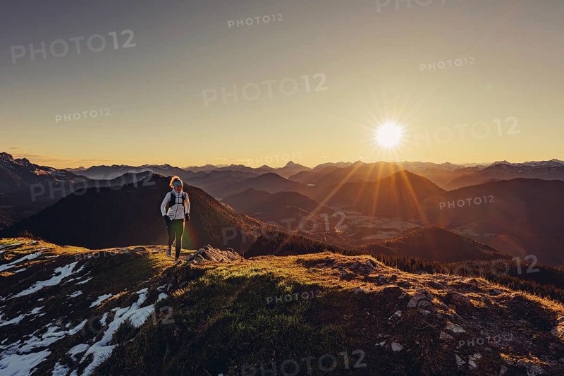 Trail running in autumn on the Jochberg on Lake Walchensee against the wonderful backdrop of the Alps, Bavaria, Germany, Europe
