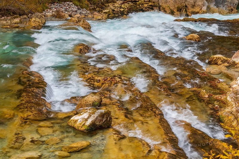 The Riss creek flowing through an autumnal landscape in the Eng valley