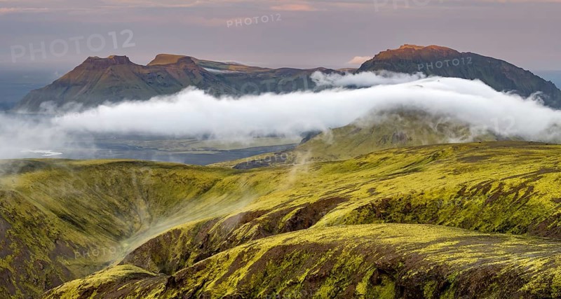 Fog between mountains, moss-covered volcanic mountain landscape, at sunset, Pakgil, Iceland, Europe