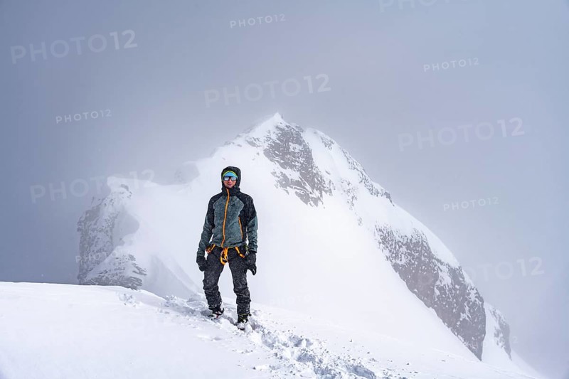 Ski tourers climbing the Wildhorn, Snowy mountain landscape and fog, Bernese Alps, Bernese Oberland, Switzerland, Europe