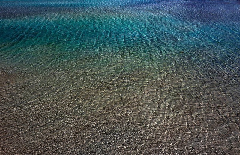Drone shot, glittering water surface on the beach of Elafonisi, west coast, Crete, Greece, Europe