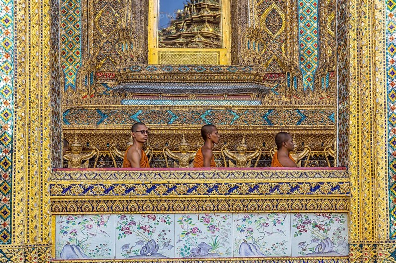 Wat Phra Kaeo temple, royal palace. Royal chapel with Buddhist monks and novices. Bangkok, Thailand, Asia