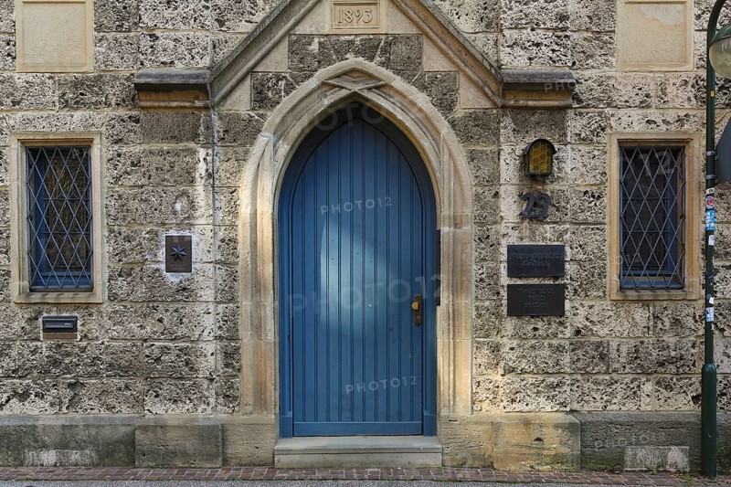 Entrance, blue wooden door, lodge sign, writing, letters, information board at the Marchtaler Hof, former Pfleghof of the Obermarchtal monastery. Seat of a Masonic lodge since 1886, Reutlingen, Baden-Württemberg, Germany, Europe