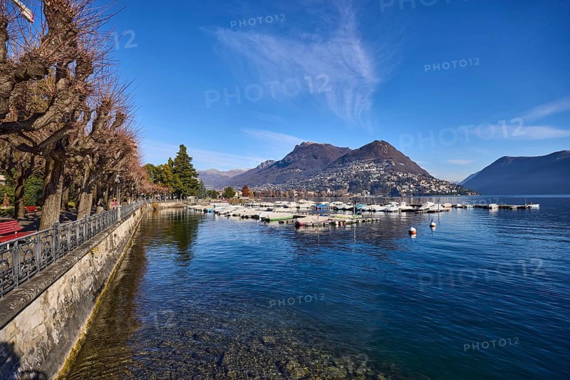 Lake, mountains, haze, marina, trees, lakeside promenade, blue sky, veil clouds, Lake Lugano, Lugano, district Lugano, canton Ticino, Switzerland, Europe