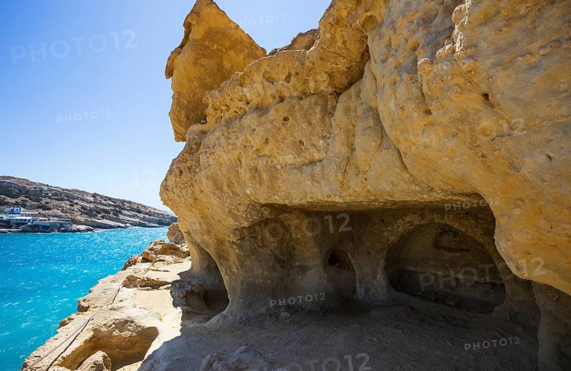 View from the rock caves to the beach of Matala, south coast, Crete, Greece, Europe
