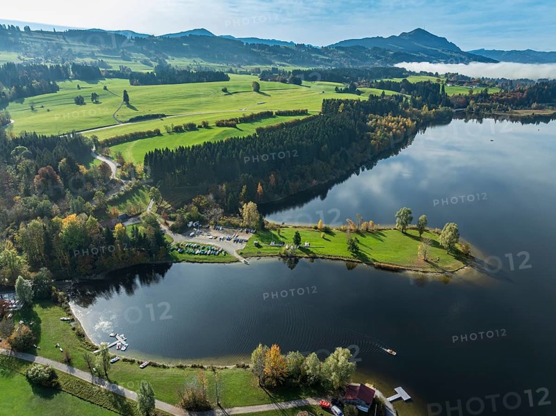 Sports facility and bathing area, lake Rottachsee, at village Petersthal, mt. Gruenten in the back, autumn, aerial view, Allgaeu, Bavaria, Germany, Europe