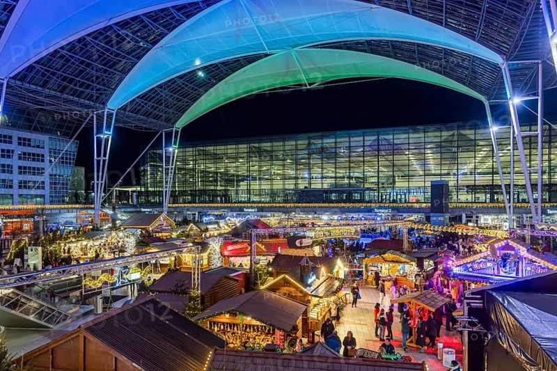 Christmas market at the airport in the evening, market stalls decorated for Christmas in front of the terminal Munich, Bavaria, Germany, Europe
