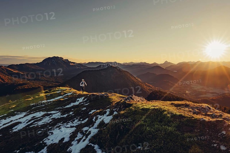 Trail running in autumn on the Jochberg on Lake Walchensee against the wonderful backdrop of the Alps, Bavaria, Germany, Europe