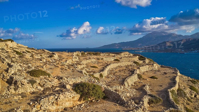 Drone shot, Archaeological site, Ancient ruins on a rocky coast overlooking the sea, Acropolis hill, Ruins of an acropolis, Arkasa, West coast, Karpathos, Dodecanese, Greek Islands, Greece, Europe