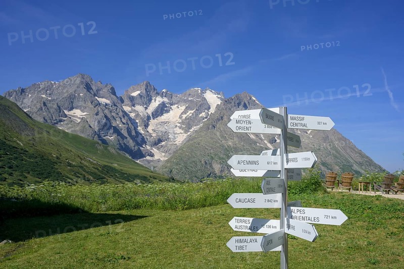 Signpost behind Pointe Piaget and La Meije seen from the botanical garden Jardin du Lautaret, Villar-d'Arêne, Département Hautes-Alpes, France, Europe