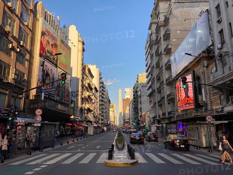 Avenida Corrientes with the obelisk in the city centre in the evening light, Buenos Aires, Argentina, South America
